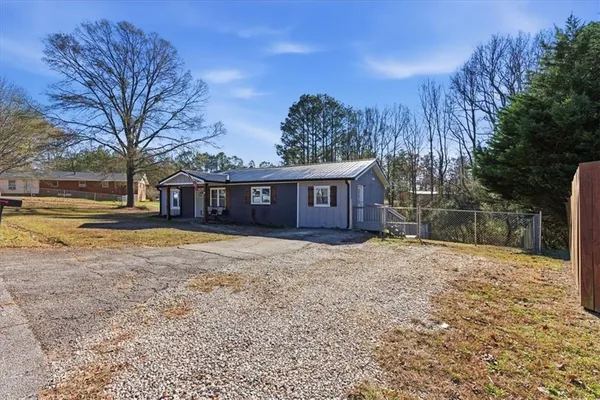 a house view with a yard space