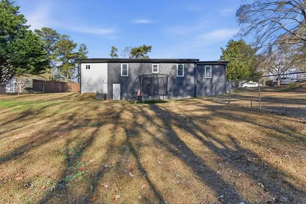 a view of a backyard of the house