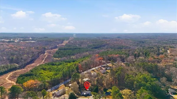 an aerial view of residential house with outdoor space