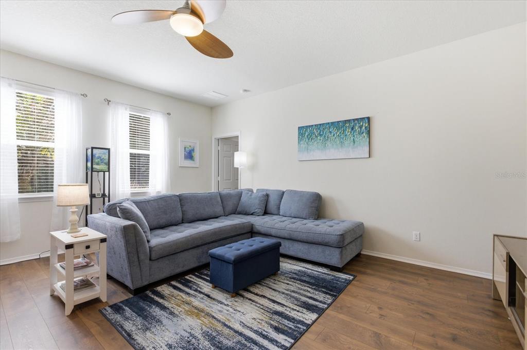 20900 Oldenburg Loop Mount Dora, FL 32757 - Photo 14 of 44 a living room with furniture wooden floor and window