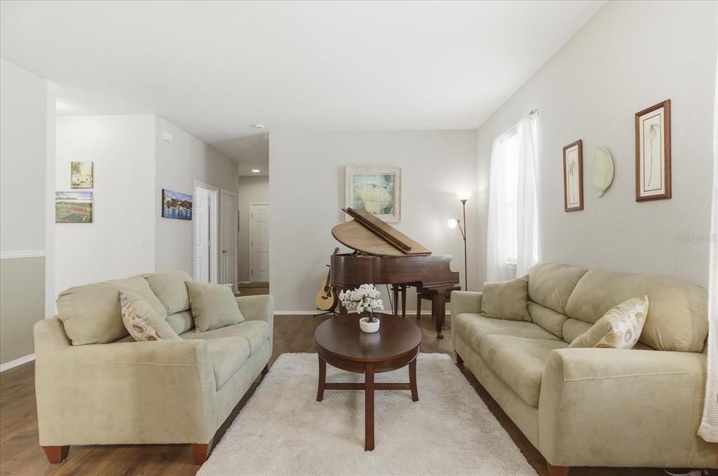 20900 Oldenburg Loop Mount Dora, FL 32757 - Photo 17 of 44 a living room with furniture and a couch