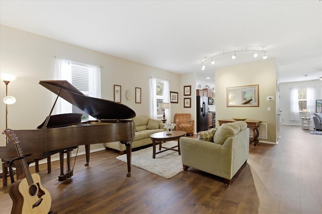 20900 Oldenburg Loop Mount Dora, FL 32757 - Photo 18 of 44 a living room with furniture and a wooden floor