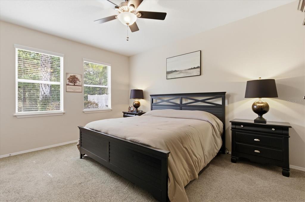 20900 Oldenburg Loop Mount Dora, FL 32757 - Photo 19 of 44 a bedroom with a bed and a window