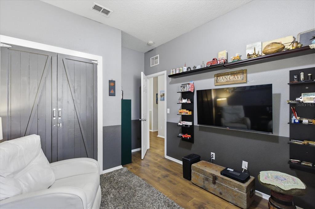 20900 Oldenburg Loop Mount Dora, FL 32757 - Photo 31 of 44 a living room with furniture and a flat screen tv