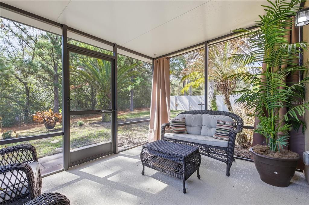 20900 Oldenburg Loop Mount Dora, FL 32757 - Photo 32 of 44 a living room with furniture and a large window