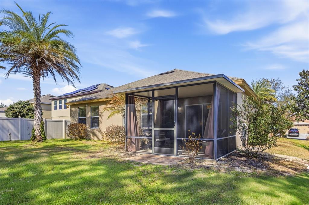 20900 Oldenburg Loop Mount Dora, FL 32757 - Photo 34 of 44 a view of a house with a yard and pathway