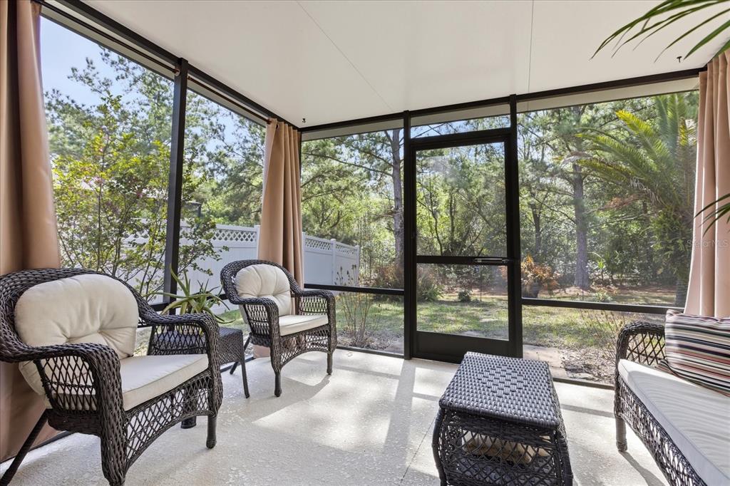 20900 Oldenburg Loop Mount Dora, FL 32757 - Photo 35 of 44 a living room with furniture and a large window