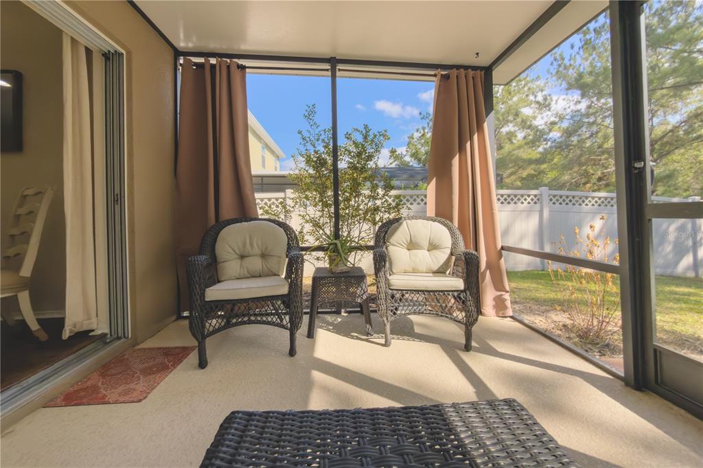 20900 Oldenburg Loop Mount Dora, FL 32757 - Photo 36 of 44 a living room with a large window and table