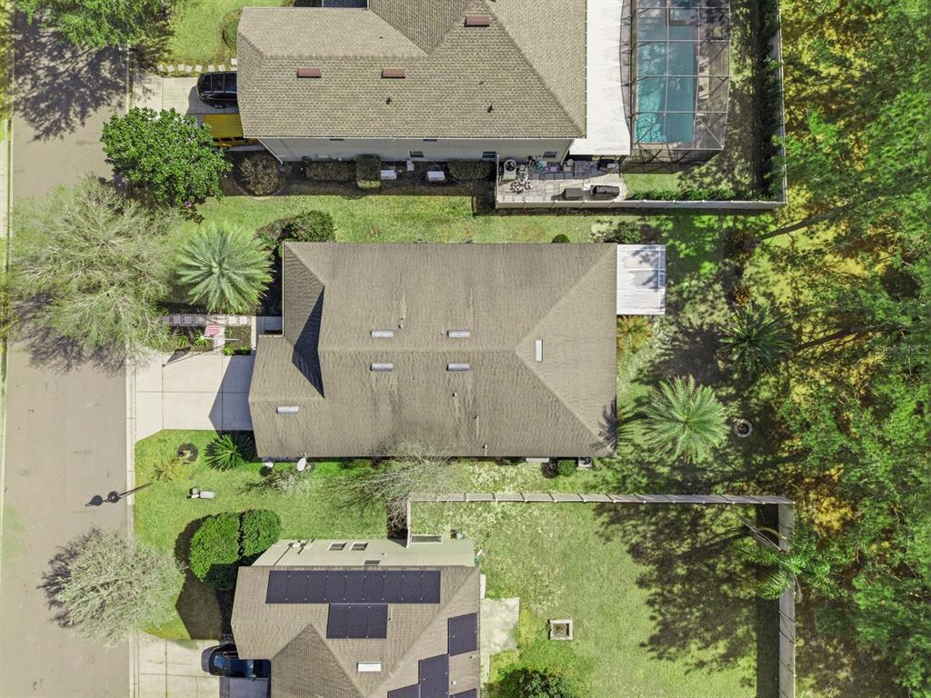 20900 Oldenburg Loop Mount Dora, FL 32757 - Photo 38 of 44 an aerial view of a house with a yard and lake view