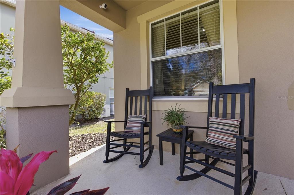 20900 Oldenburg Loop Mount Dora, FL 32757 - Photo 4 of 44 a balcony with furniture and a potted plant