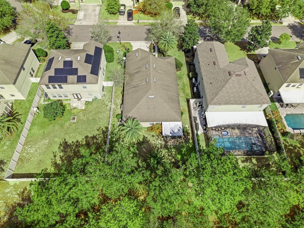 20900 Oldenburg Loop Mount Dora, FL 32757 - Photo 42 of 44 an aerial view of a house with a yard and trees