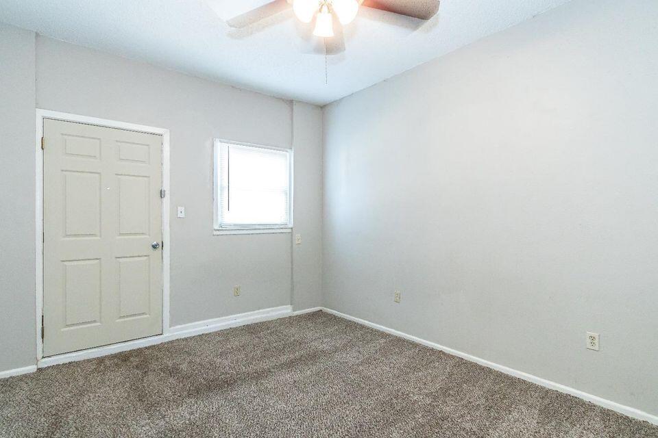 4212 42nd Street Lubbock, TX 79413 - Photo 11 of 18 an empty room with a chandelier fan