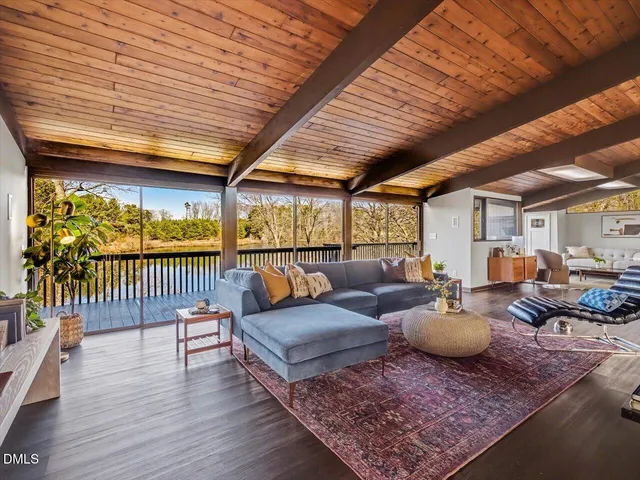 a living room with furniture and a table
