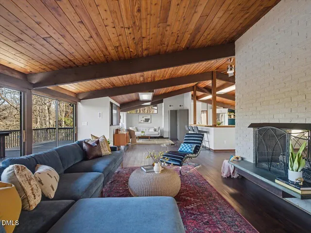 a dining room with furniture and wooden floor