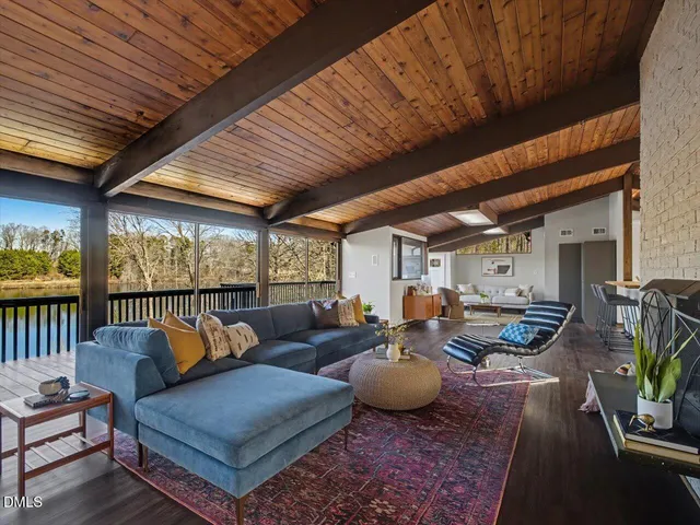 a view of a dining room with furniture and window