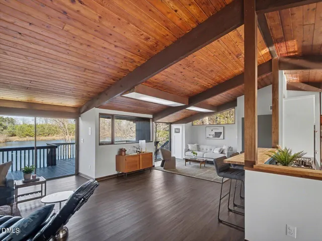 a dining room with furniture and wooden floor