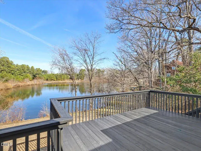 a bedroom with a bed and a potted plant