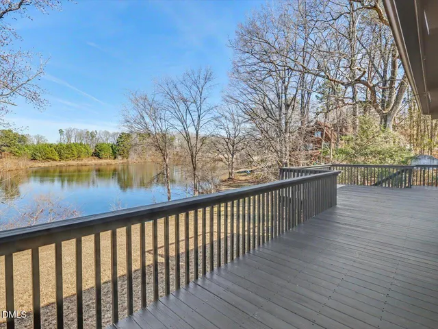 a bedroom with a large bed and a large window
