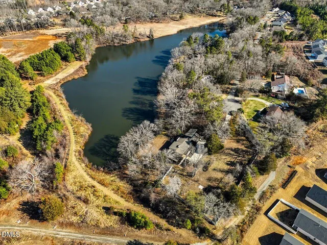 a view of a backyard with sitting area