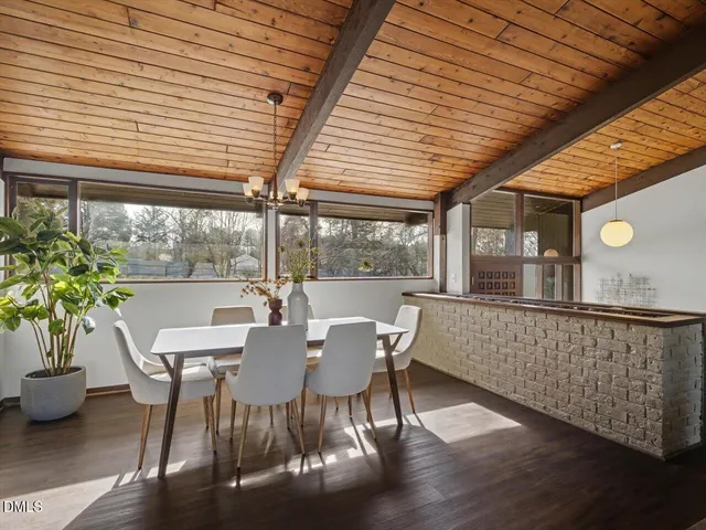 a bedroom with a large bed and a large window