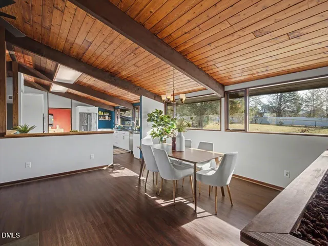 a bathroom with a toilet a sink and a mirror