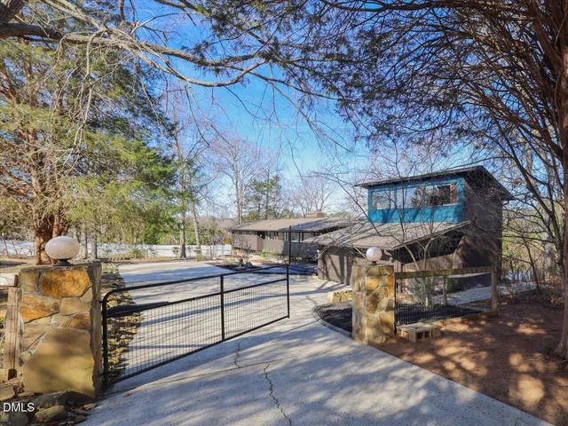 a view of house with outdoor space and sitting area