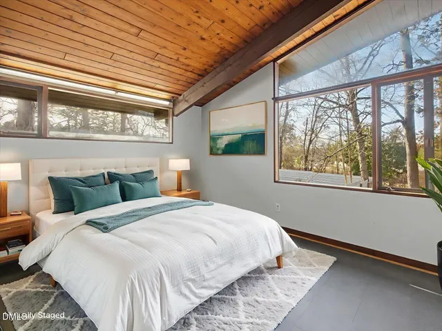 a view of a porch with a table and chairs