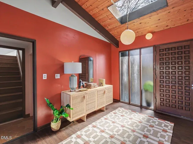 a view of a yard and a house in the background