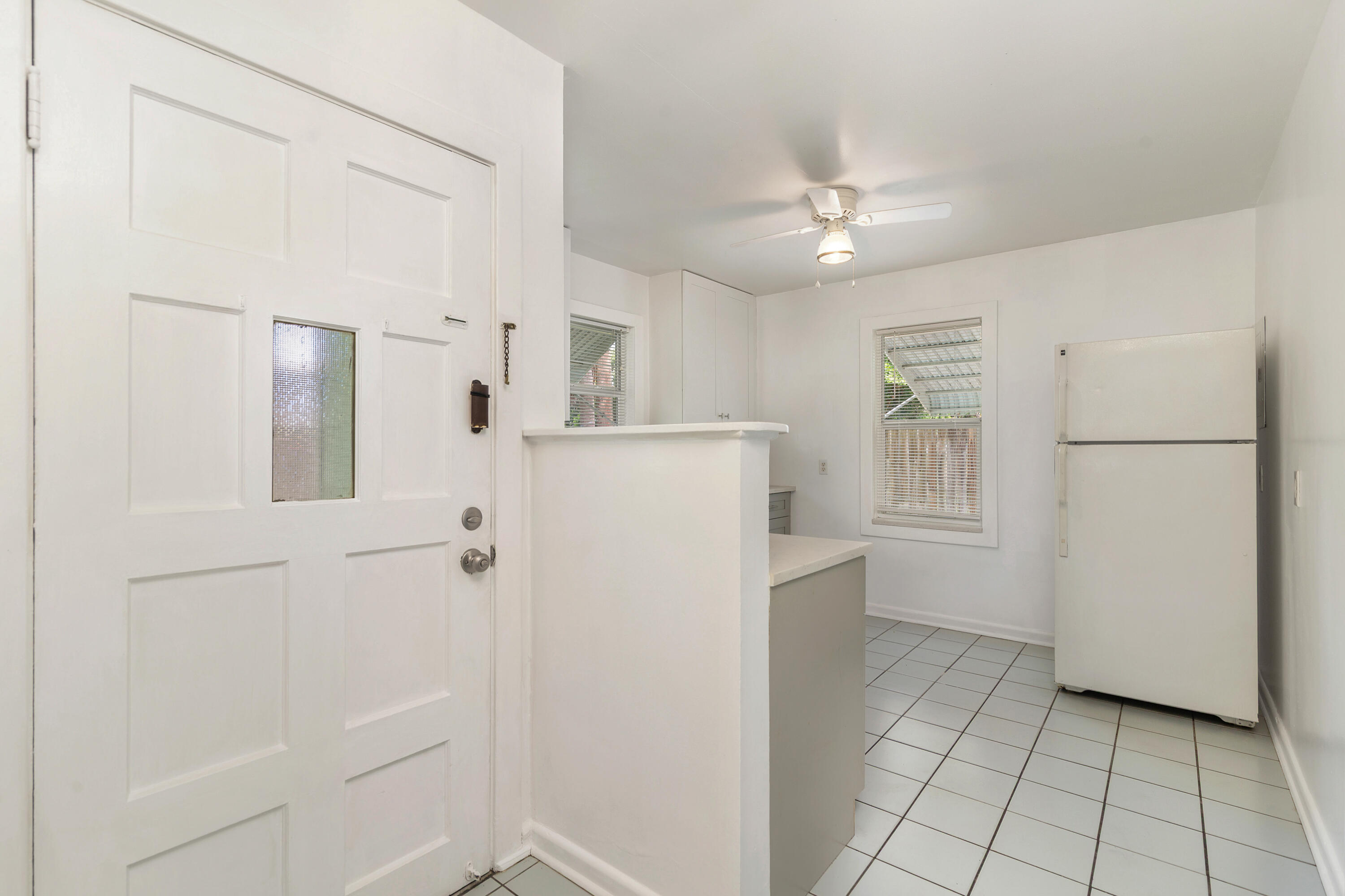 429 49th Street, Unit 2 West Palm Beach, FL 33407 - Photo 1 of 10 a view of a kitchen with a refrigerator and a stove top oven