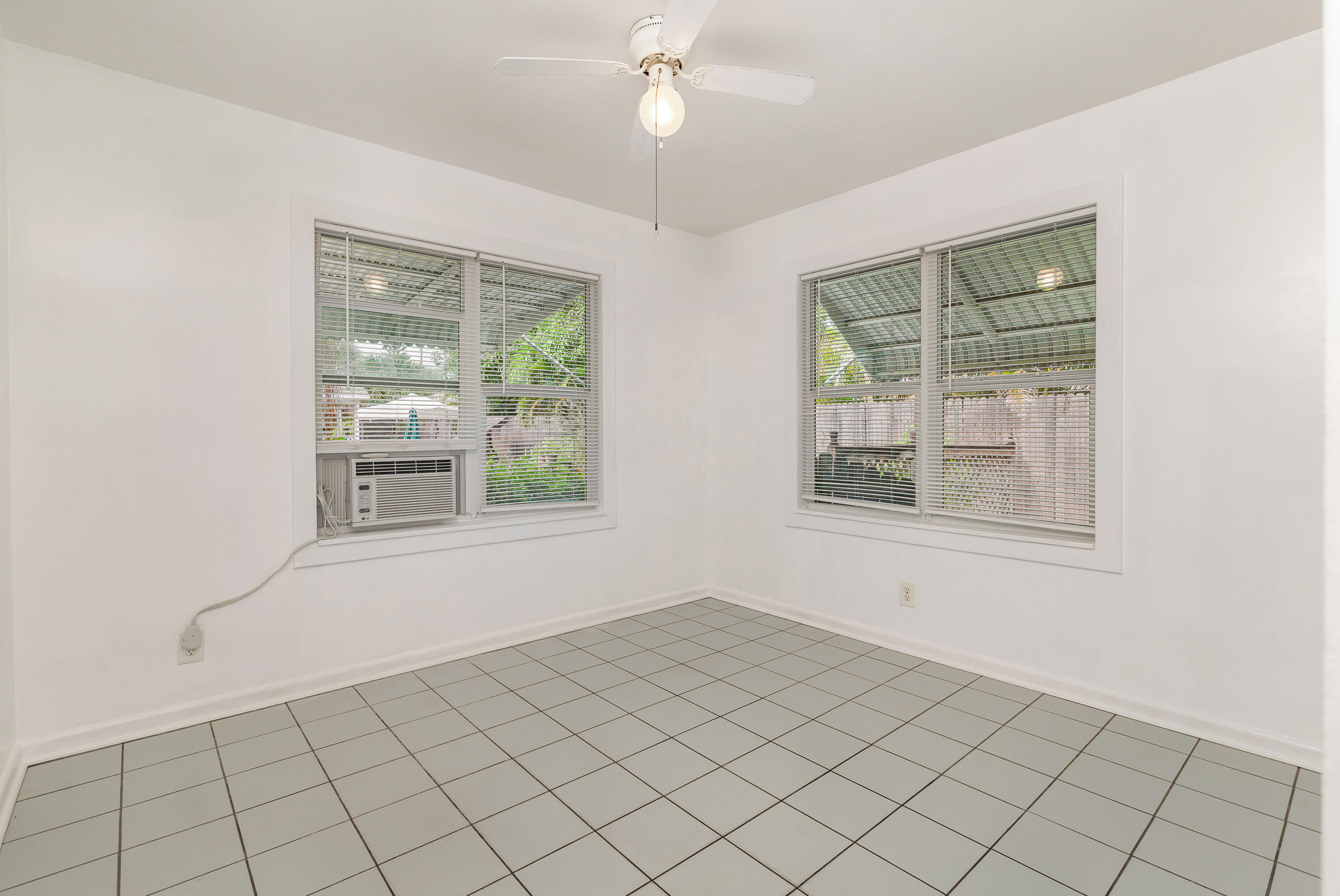 429 49th Street, Unit 2 West Palm Beach, FL 33407 - Photo 6 of 10 a view of an empty room with a window