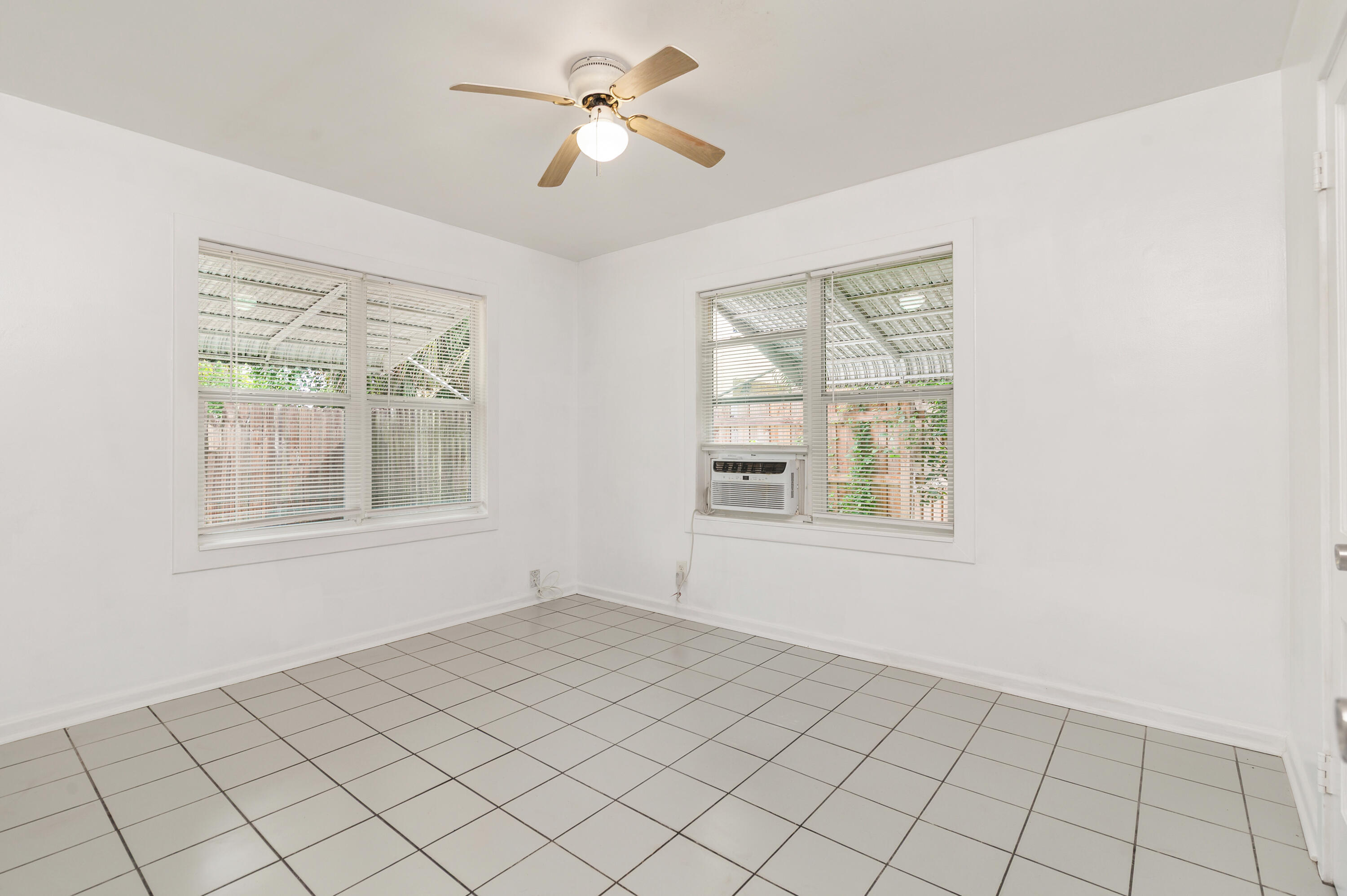 429 49th Street, Unit 2 West Palm Beach, FL 33407 - Photo 7 of 10 a view of an empty room with a window