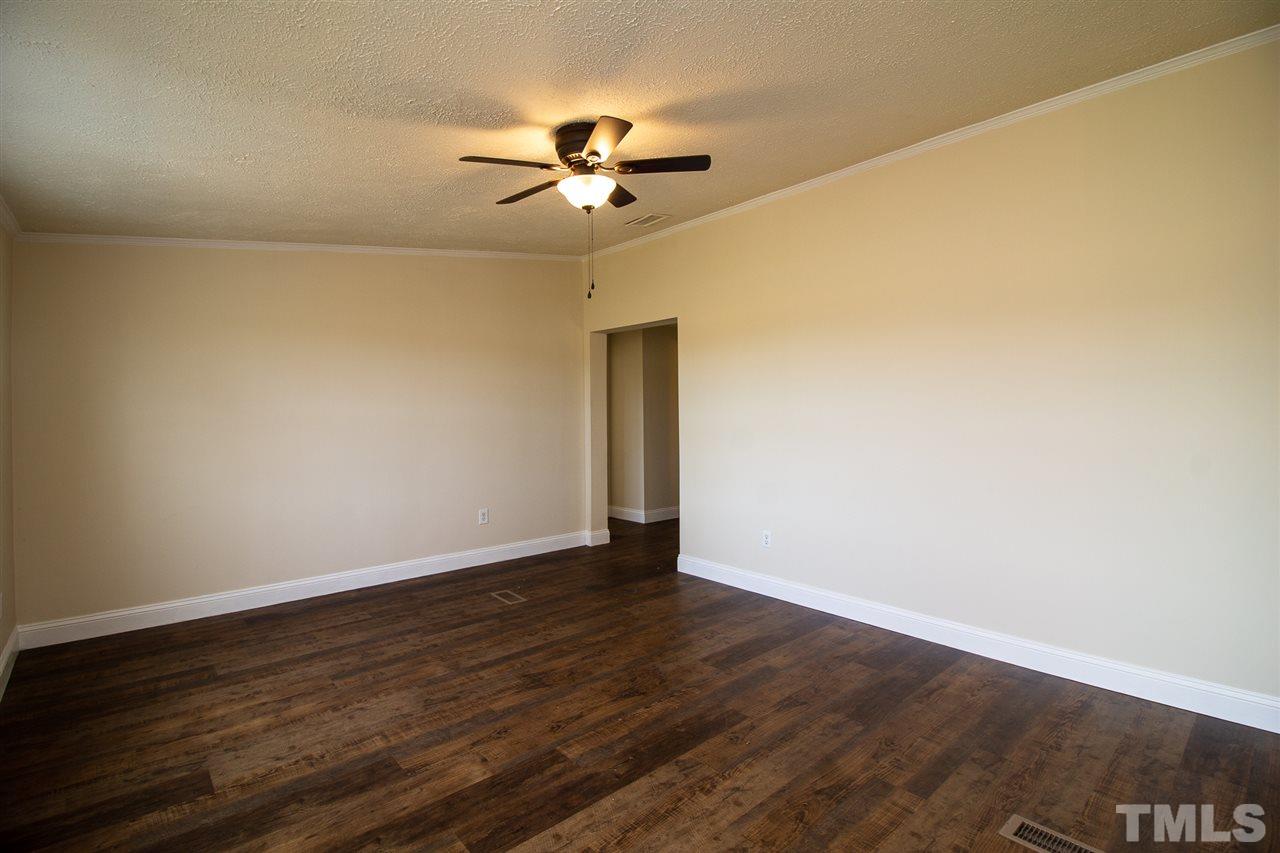 8971 Frank Road Kenly, NC 27542 - Photo 4 of 20 Livingroom with updated lighting and flooring.