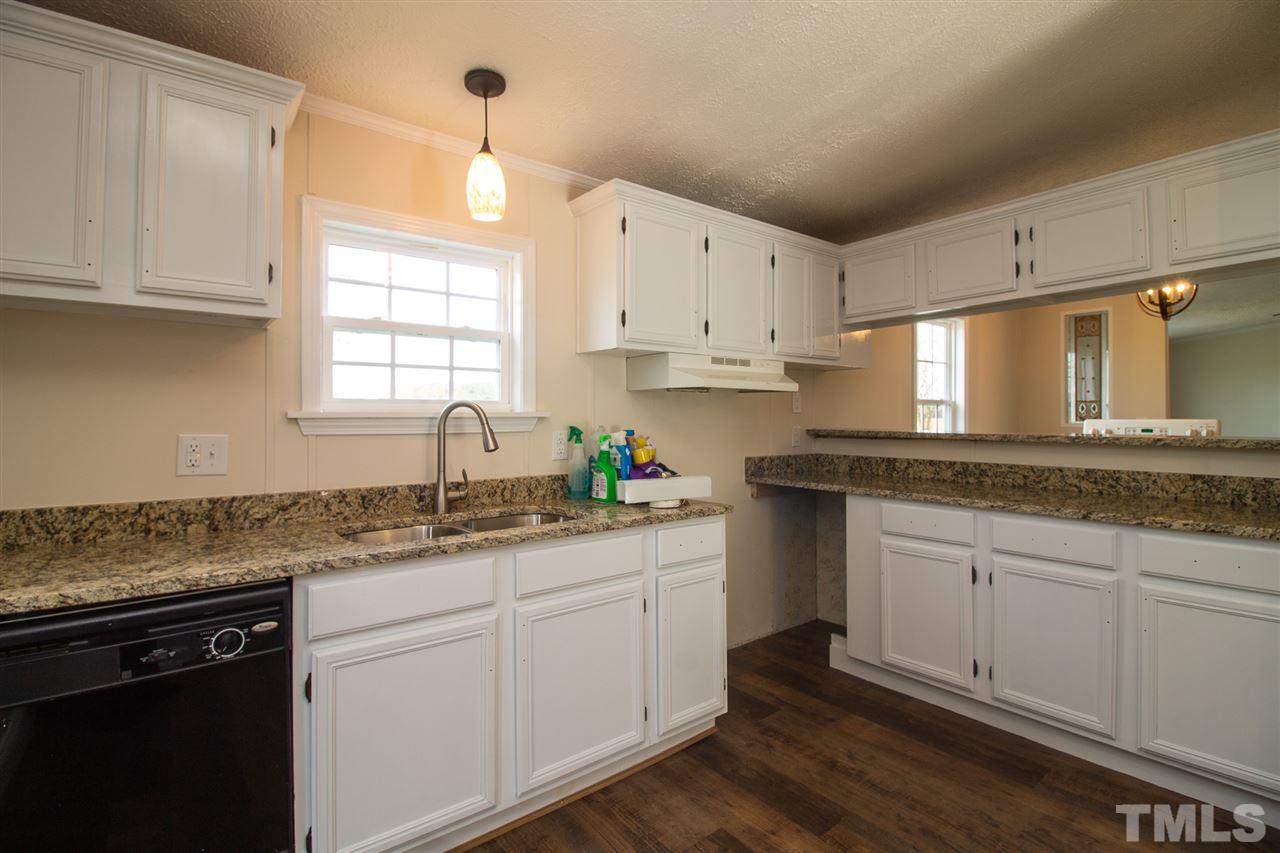 8971 Frank Road Kenly, NC 27542 - Photo 6 of 20 New kitchen countertops, cabinets, flooring, light fixtures