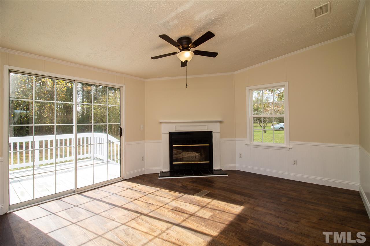 8971 Frank Road Kenly, NC 27542 - Photo 9 of 20 Family room with new ceiling fan, cozy fireplace!