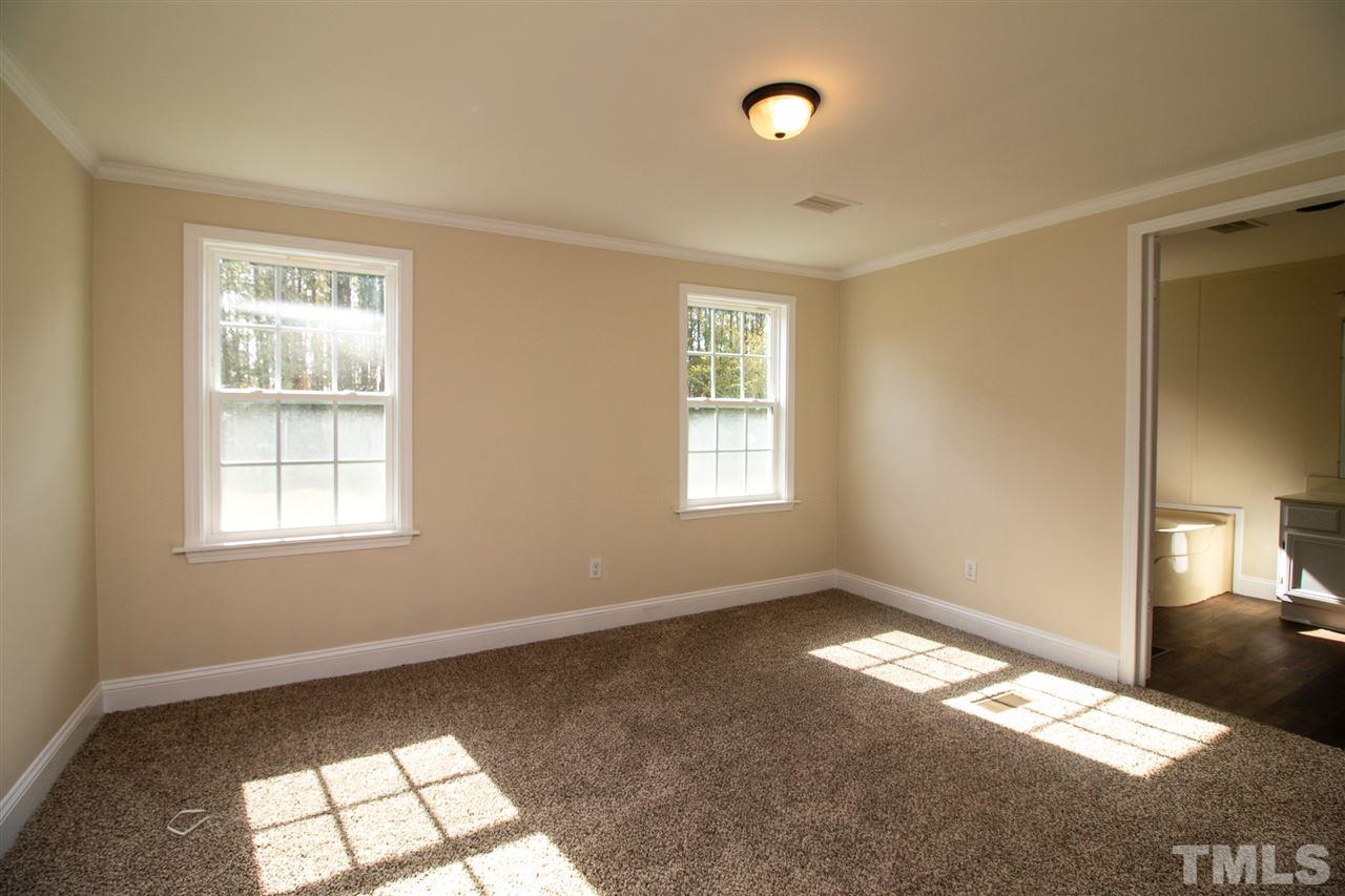 8971 Frank Road Kenly, NC 27542 - Photo 10 of 20 Master bedroom with new carpet light fixture, fresh paint