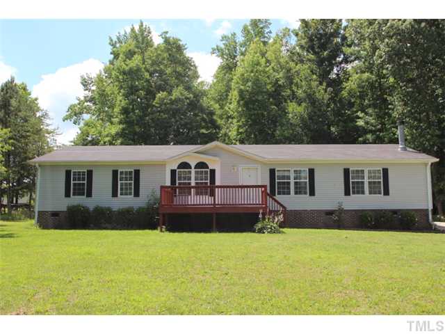 5949 Oxford Road Timberlake, NC 27583 - Photo 1 of 12 a house view with a garden space
