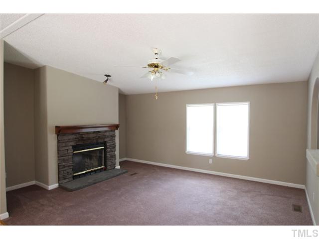 5949 Oxford Road Timberlake, NC 27583 - Photo 3 of 12 a view of empty room with a fireplace