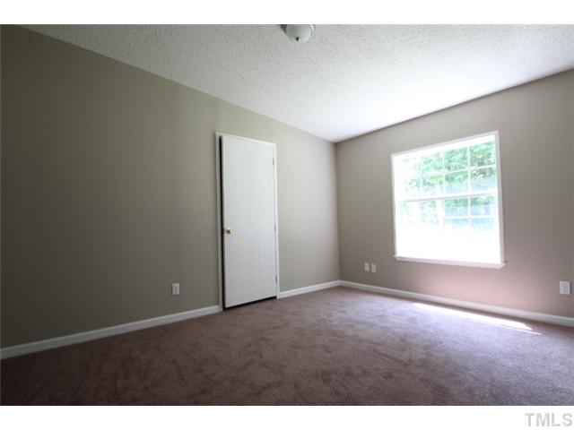 5949 Oxford Road Timberlake, NC 27583 - Photo 9 of 12 a view of an empty room with a window