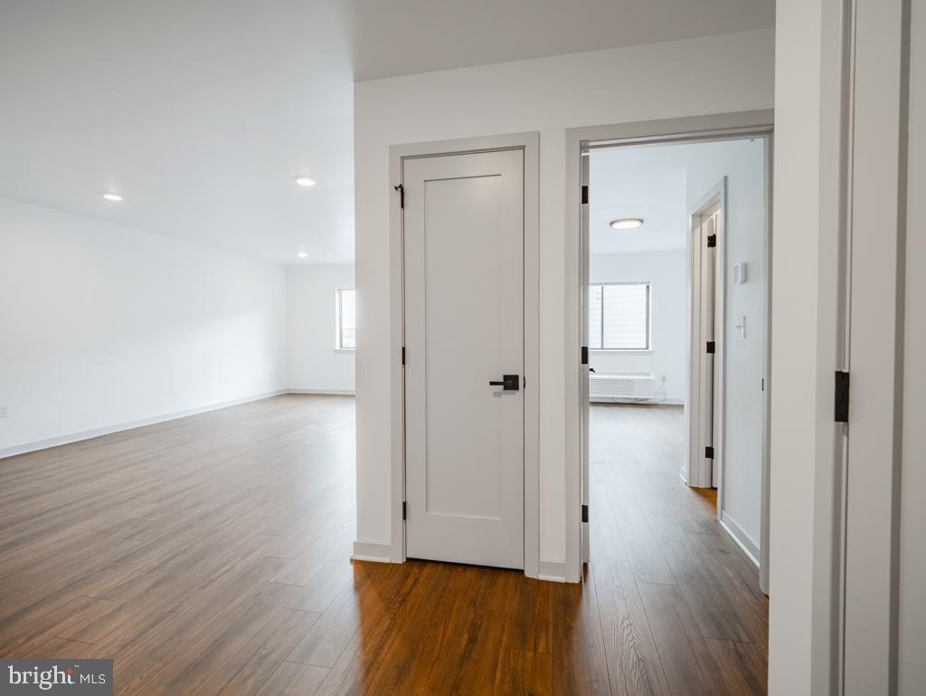 6515 Ridge Avenue, Unit 304 Philadelphia, PA 19128 - Photo 2 of 14 a view of a hallway with wooden floor