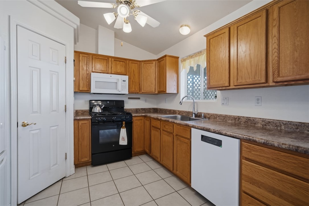 2144 Ridgeview Road Kingman, AZ 86401 - Photo 17 of 49 a kitchen with stainless steel appliances granite countertop a sink and cabinets