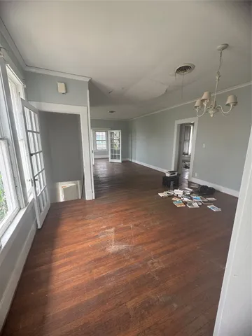 a view of a livingroom with a ceiling fan and window