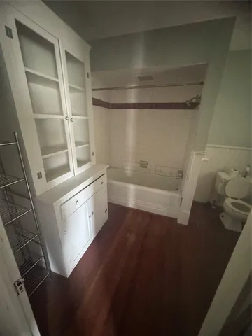 a balcony with table and chairs