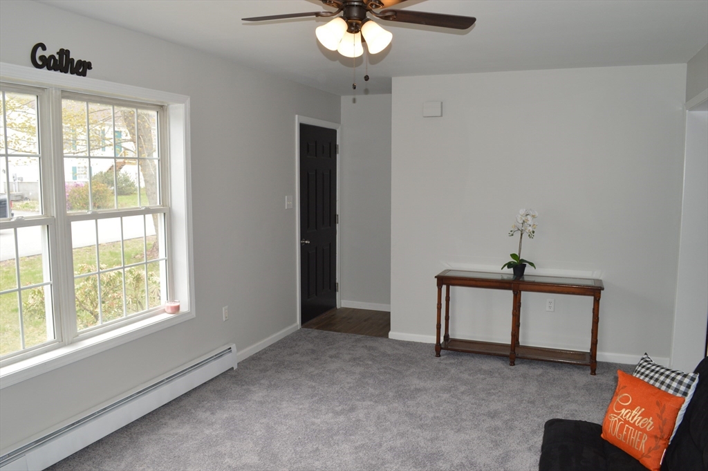 75 Eagle View Drive Douglas, MA 01516 - Photo 12 of 28 a living room with furniture and a window