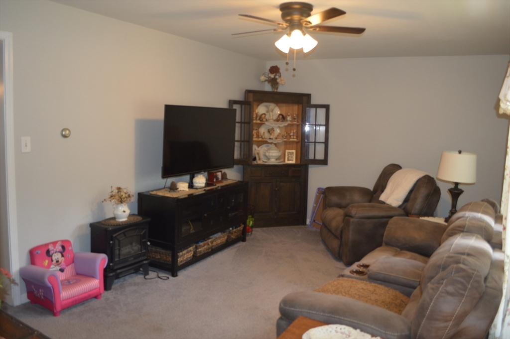 75 Eagle View Drive Douglas, MA 01516 - Photo 13 of 28 a living room with furniture and a flat screen tv
