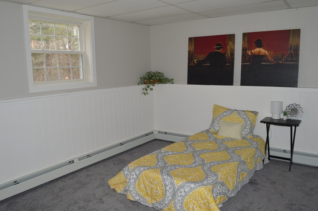 75 Eagle View Drive Douglas, MA 01516 - Photo 20 of 28 a bed sitting in a bedroom next to a window