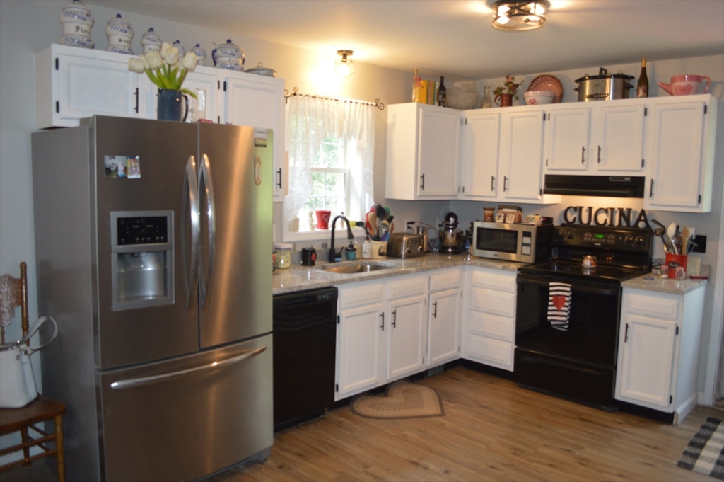 75 Eagle View Drive Douglas, MA 01516 - Photo 3 of 28 a kitchen with stainless steel appliances a refrigerator sink and cabinets