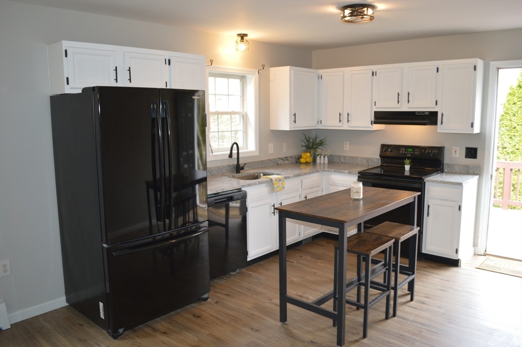 75 Eagle View Drive Douglas, MA 01516 - Photo 9 of 28 a kitchen with a refrigerator a stove a sink and a refrigerator