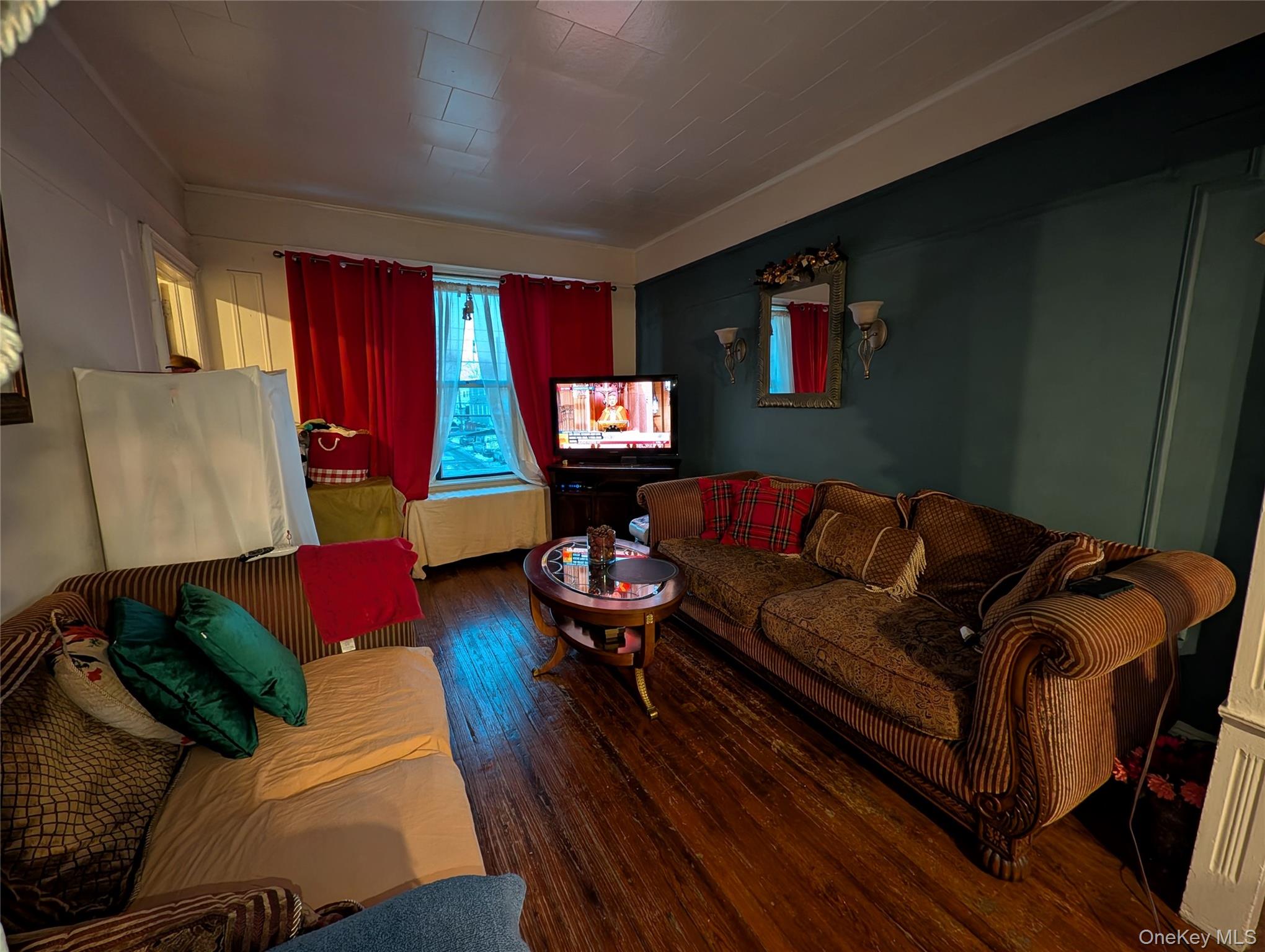 90-46 76th Street Queens, NY 11421 - Photo 17 of 32 a living room with furniture and a lamp