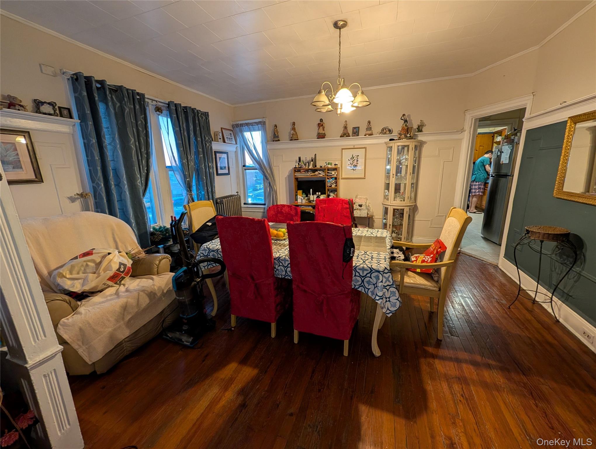 90-46 76th Street Queens, NY 11421 - Photo 20 of 32 a view of a dining room with furniture a chandelier and wooden floor