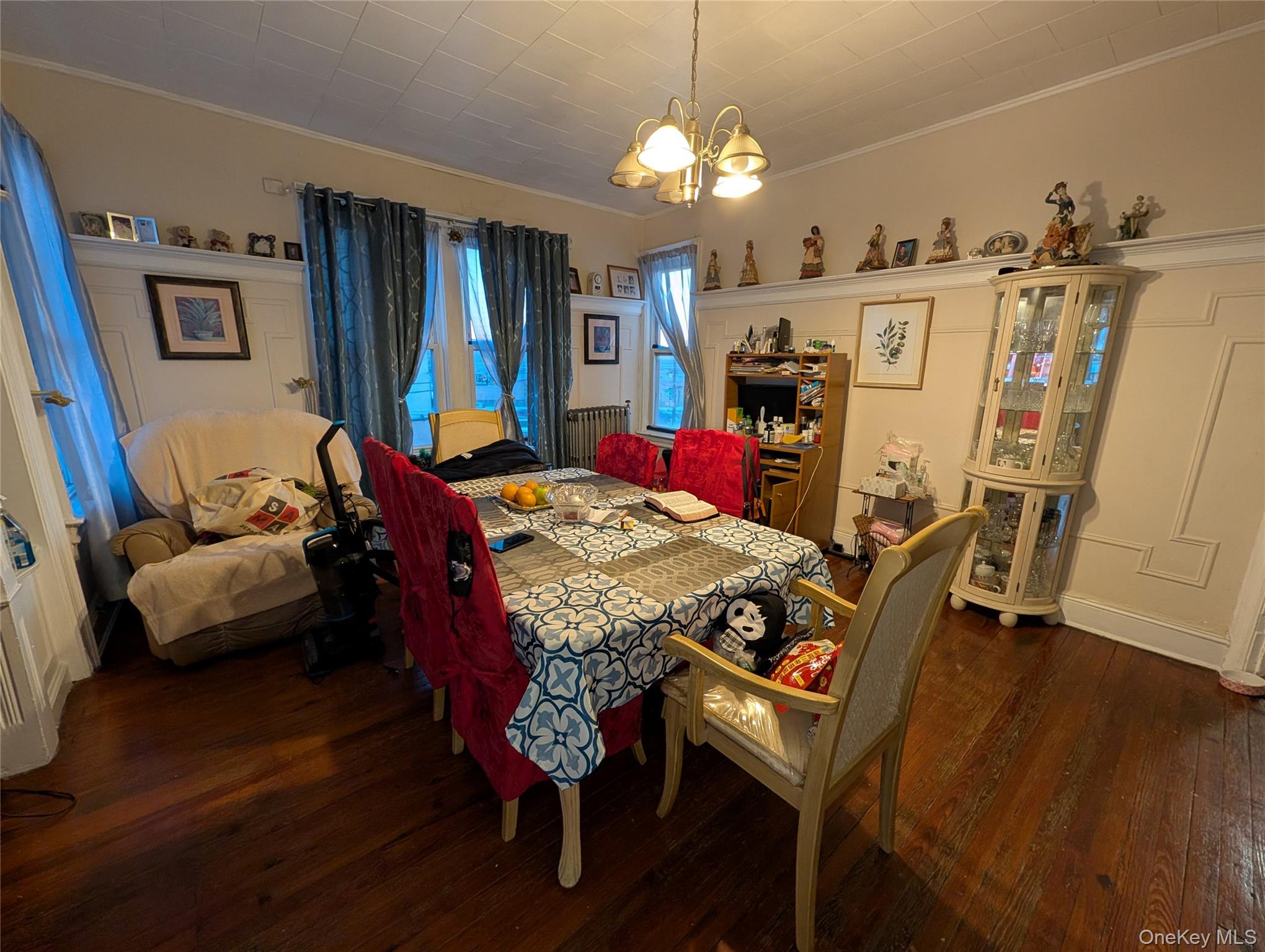 90-46 76th Street Queens, NY 11421 - Photo 21 of 32 a view of a dining room with furniture and wooden floor